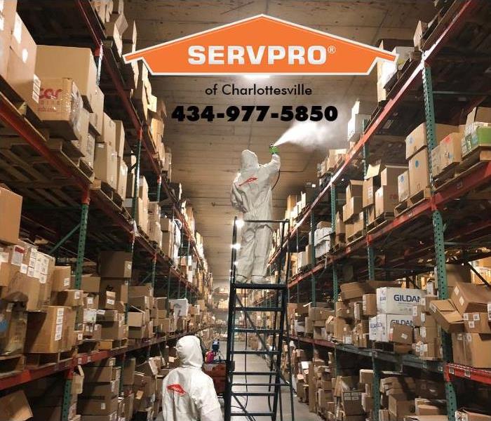 SERVPRO professionals are shown decontaminating a warehouse.