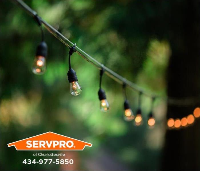 Outdoor party lights are lit on a summer night.