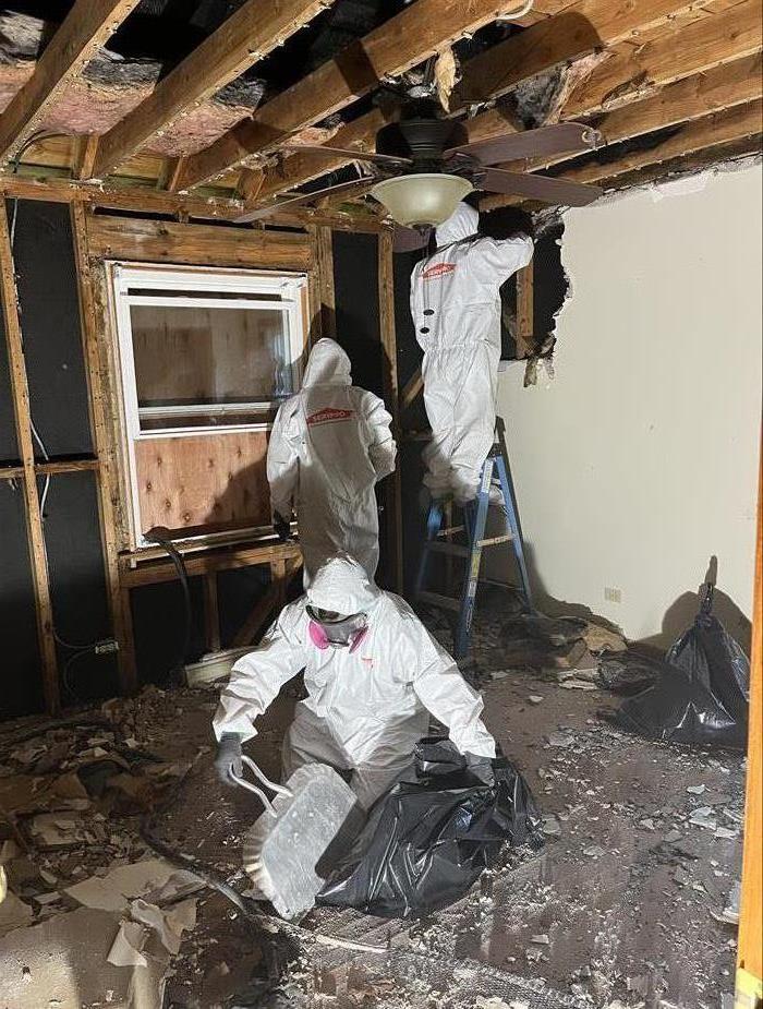 This image includes SERVPRO crew members assisting a fire loss job.